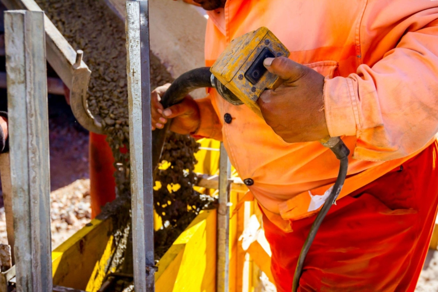 Compaction grouting service in Garland, TX with contractor mixing grout for soil stabilization