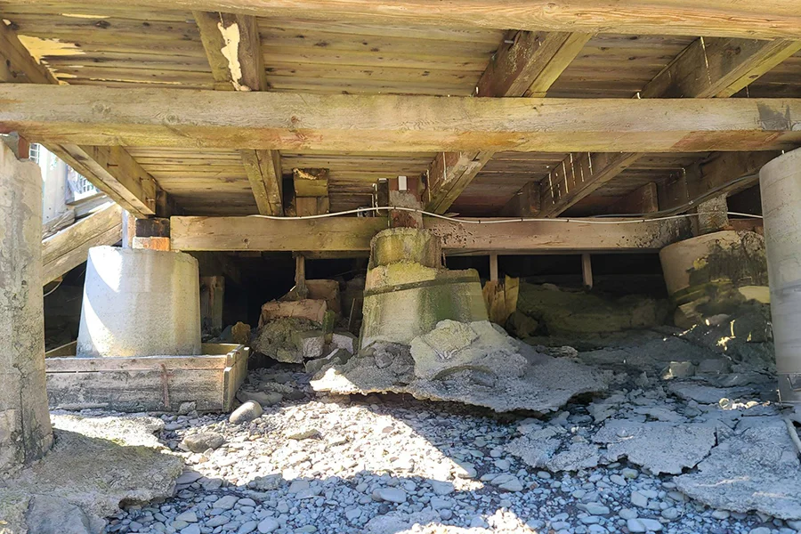 Damaged pier and beam foundation with deteriorated concrete piers needing repair in Garland, TX