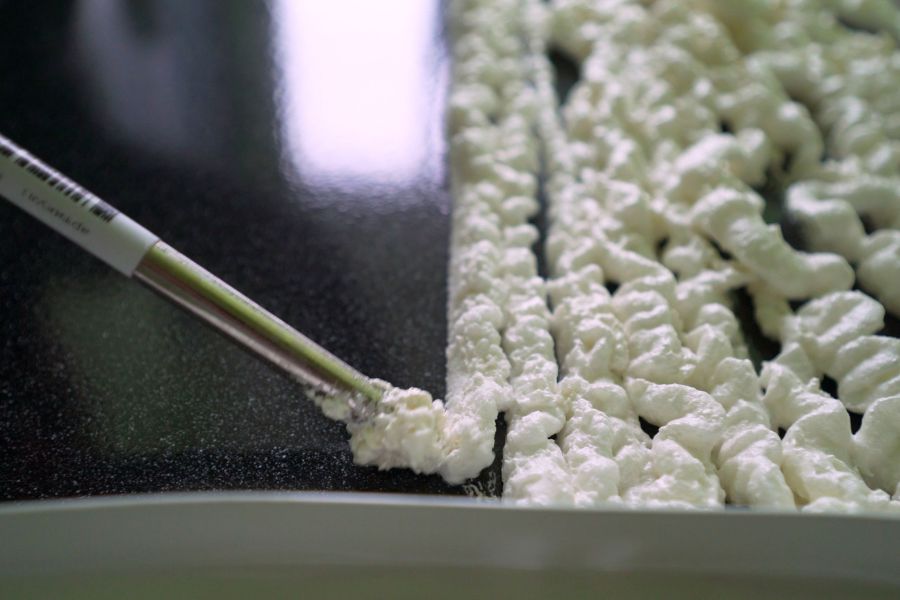 Close-up of expanding polyurethane foam used for concrete lifting and foundation repair in Garland, TX