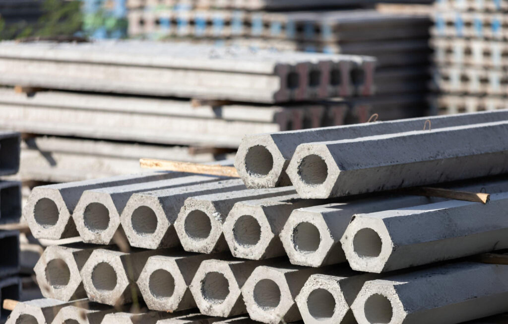 Hexagonal pressed concrete pilings ready for foundation repair installation in Garland, TX